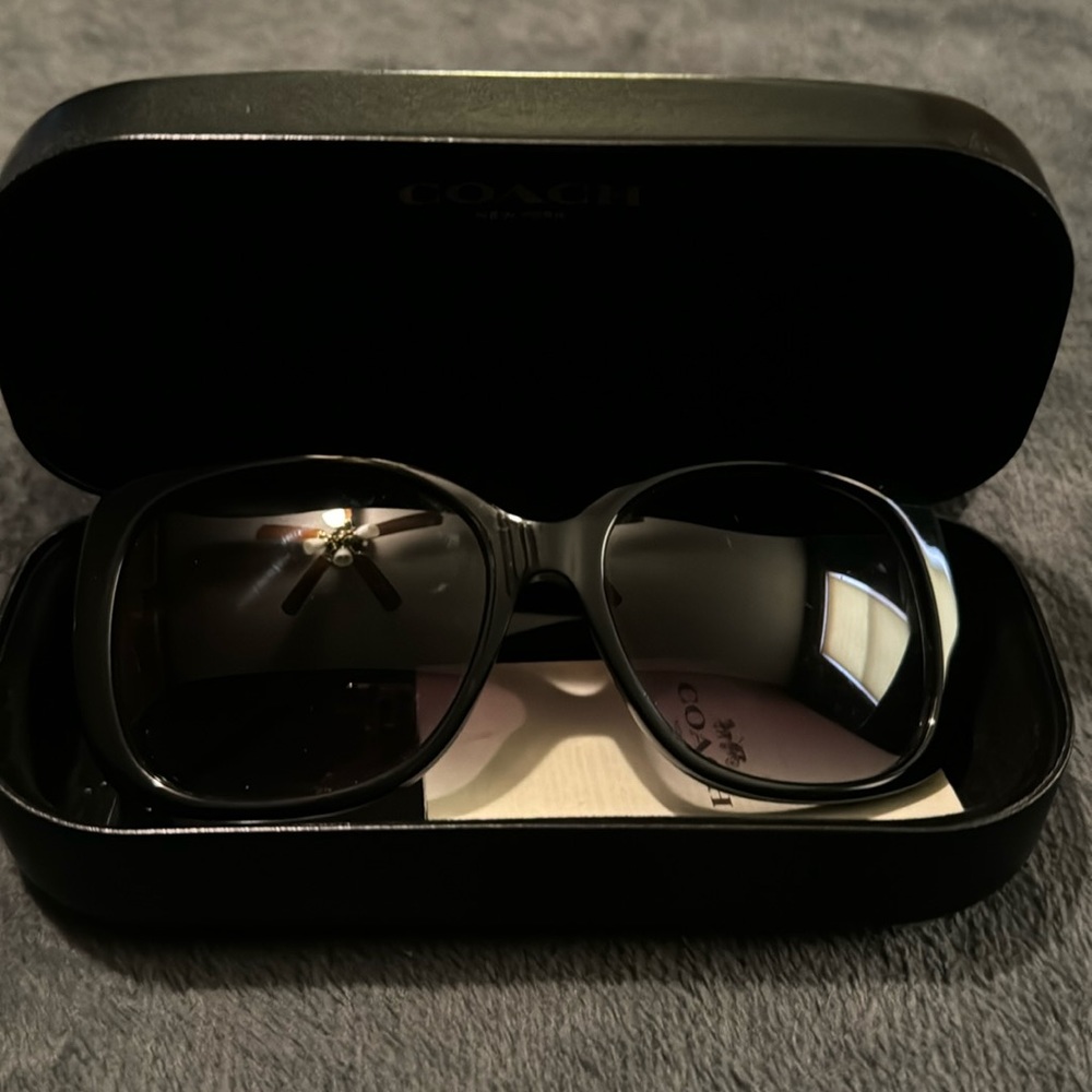 The item I’m selling is Coach sunglasses. They are black with a coach symbol.